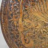 Asian coffee table carved with dragons and peacocks, Indonesia, early 20th century