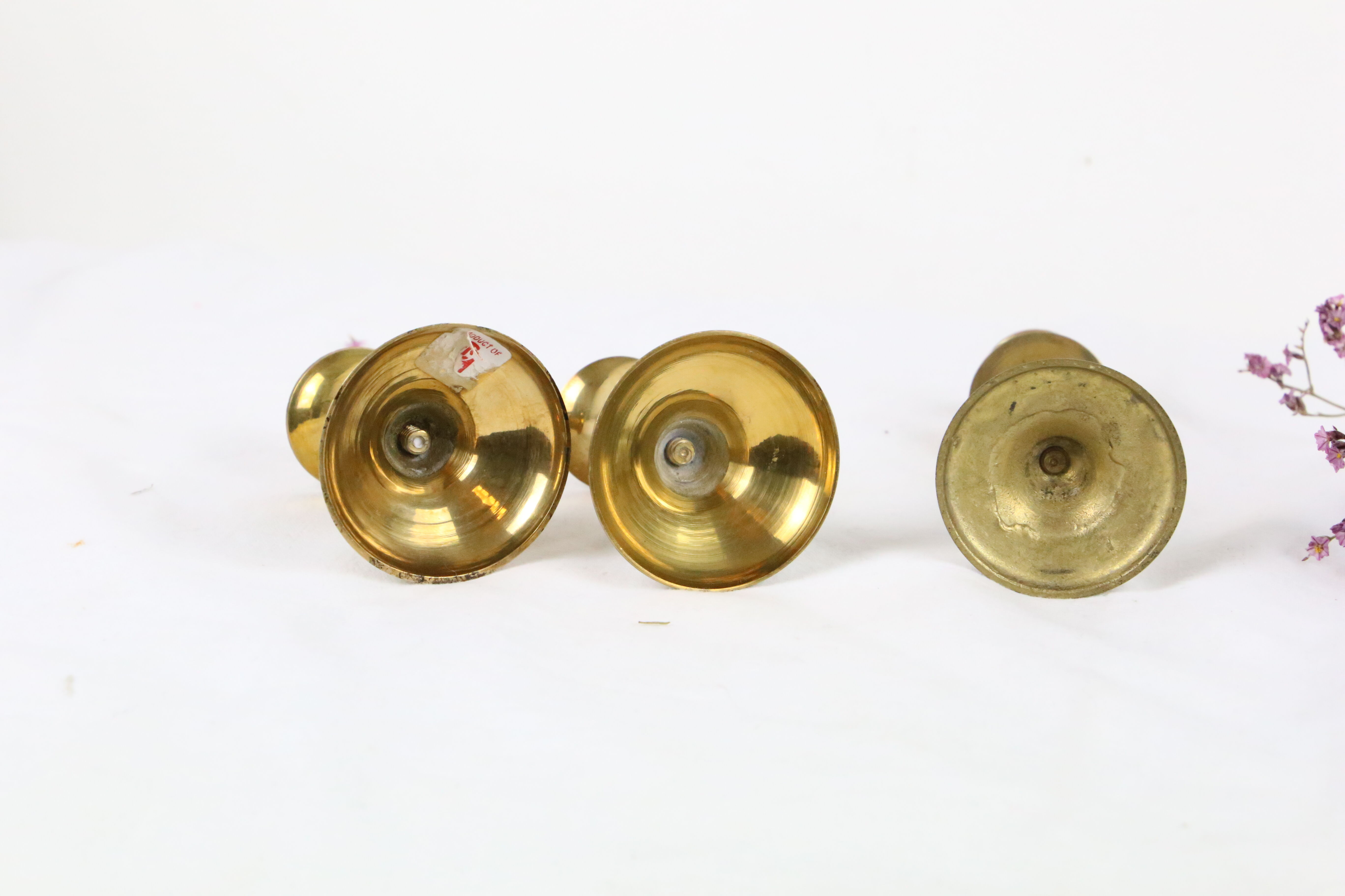 Trio of brass candle holders, vintage