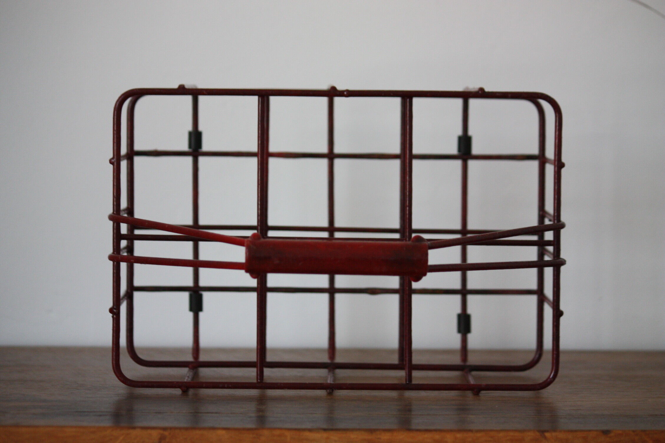 Red metal bottle holder