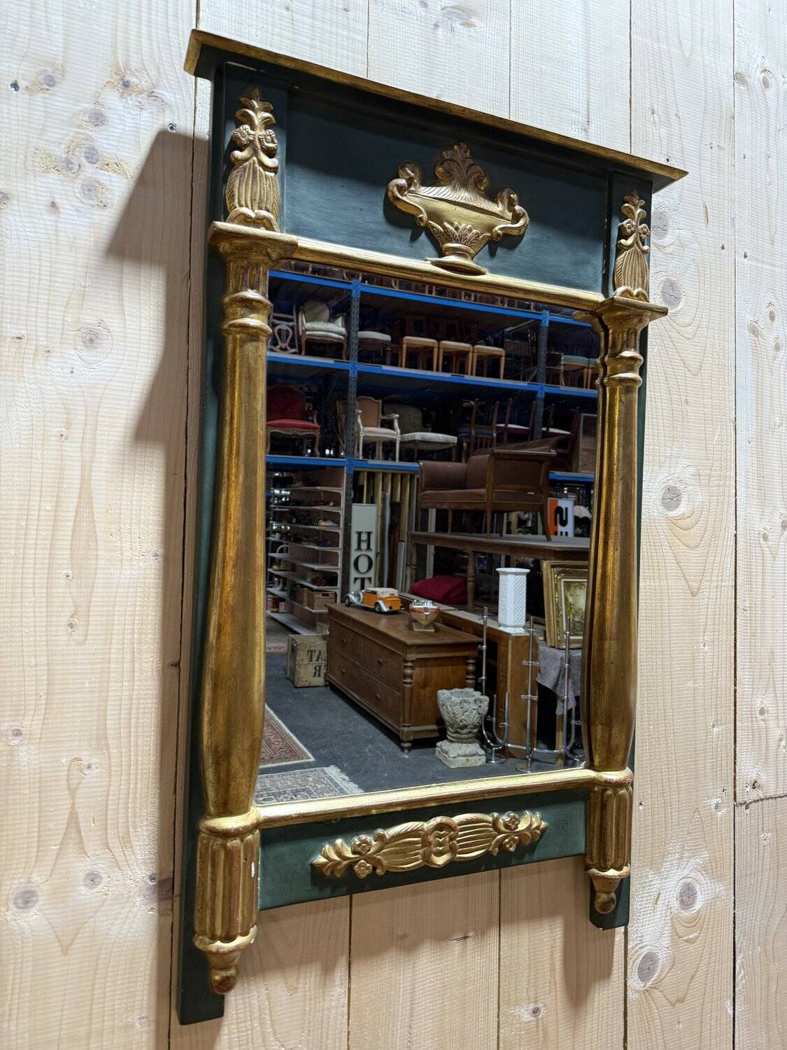Empire-style mirror in gilded wood
