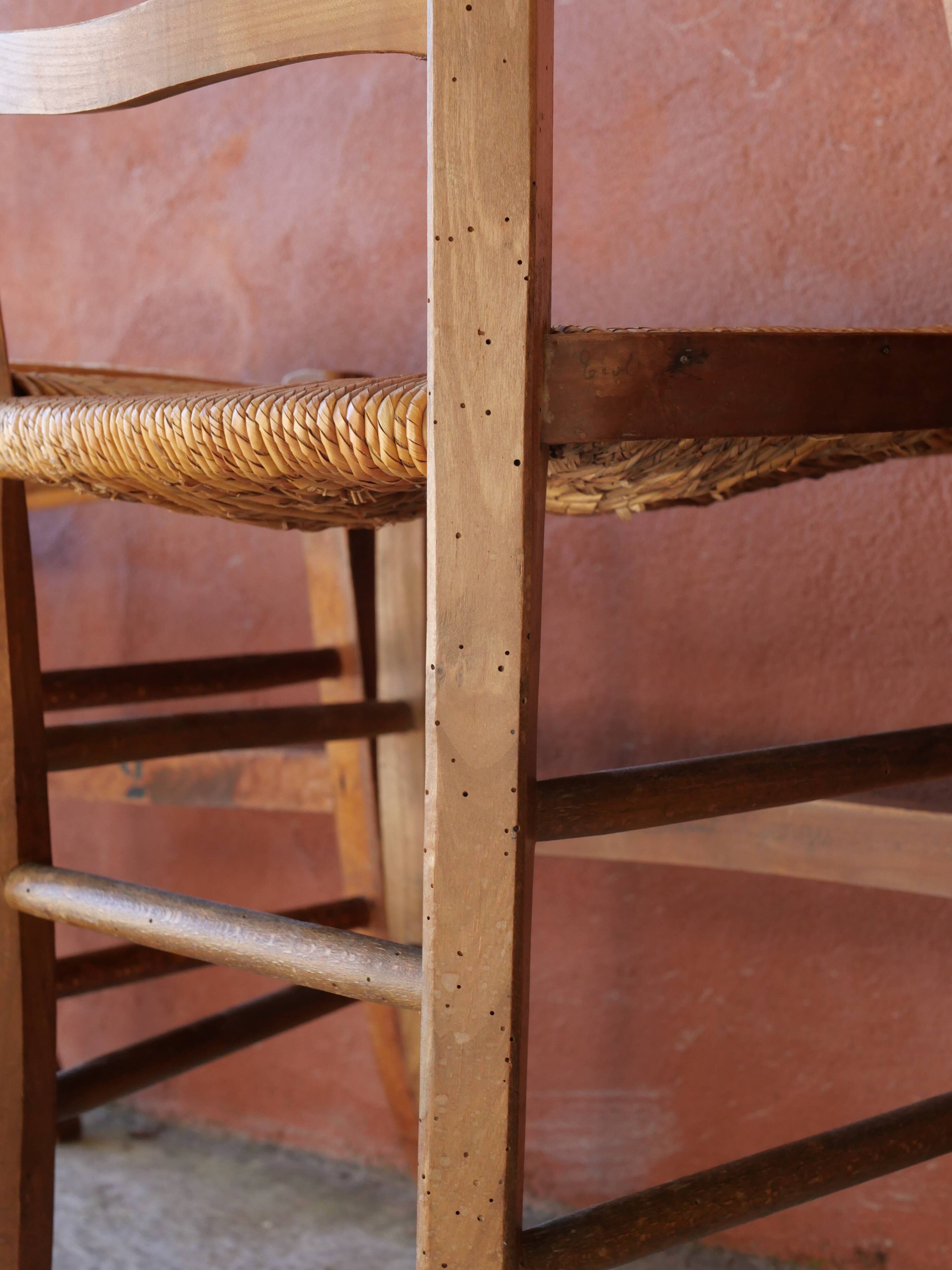 Set of 5 mismatched straw chairs.
