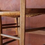 Set of 5 mismatched straw chairs.