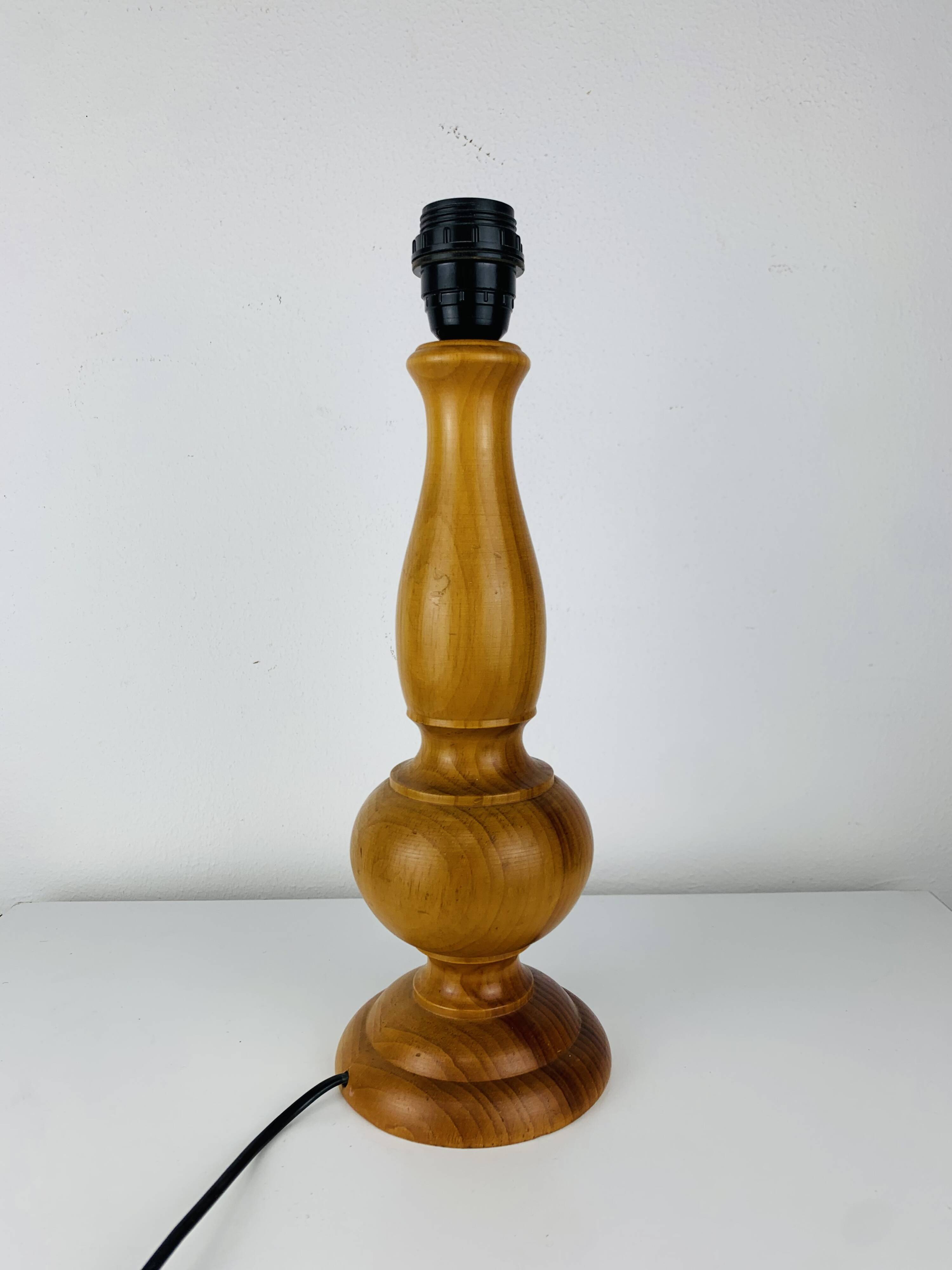 Turned wood lamp with orange shade, 1970s.