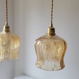 Trio of amber glass pendant lights