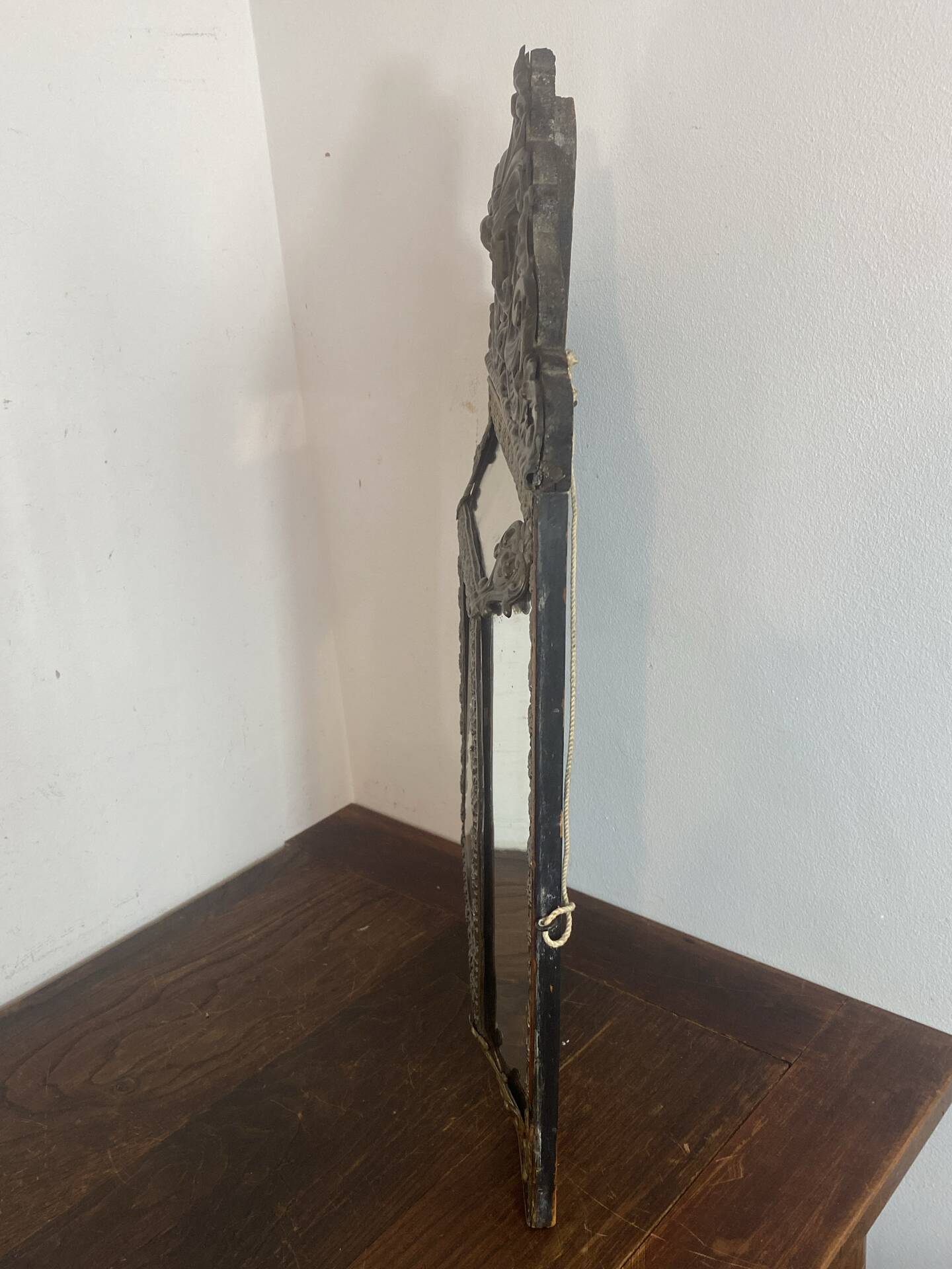 Mirror with brass repoussé frame