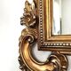 Large Italian mirror in carved wood, traditional gilding, 1980s.