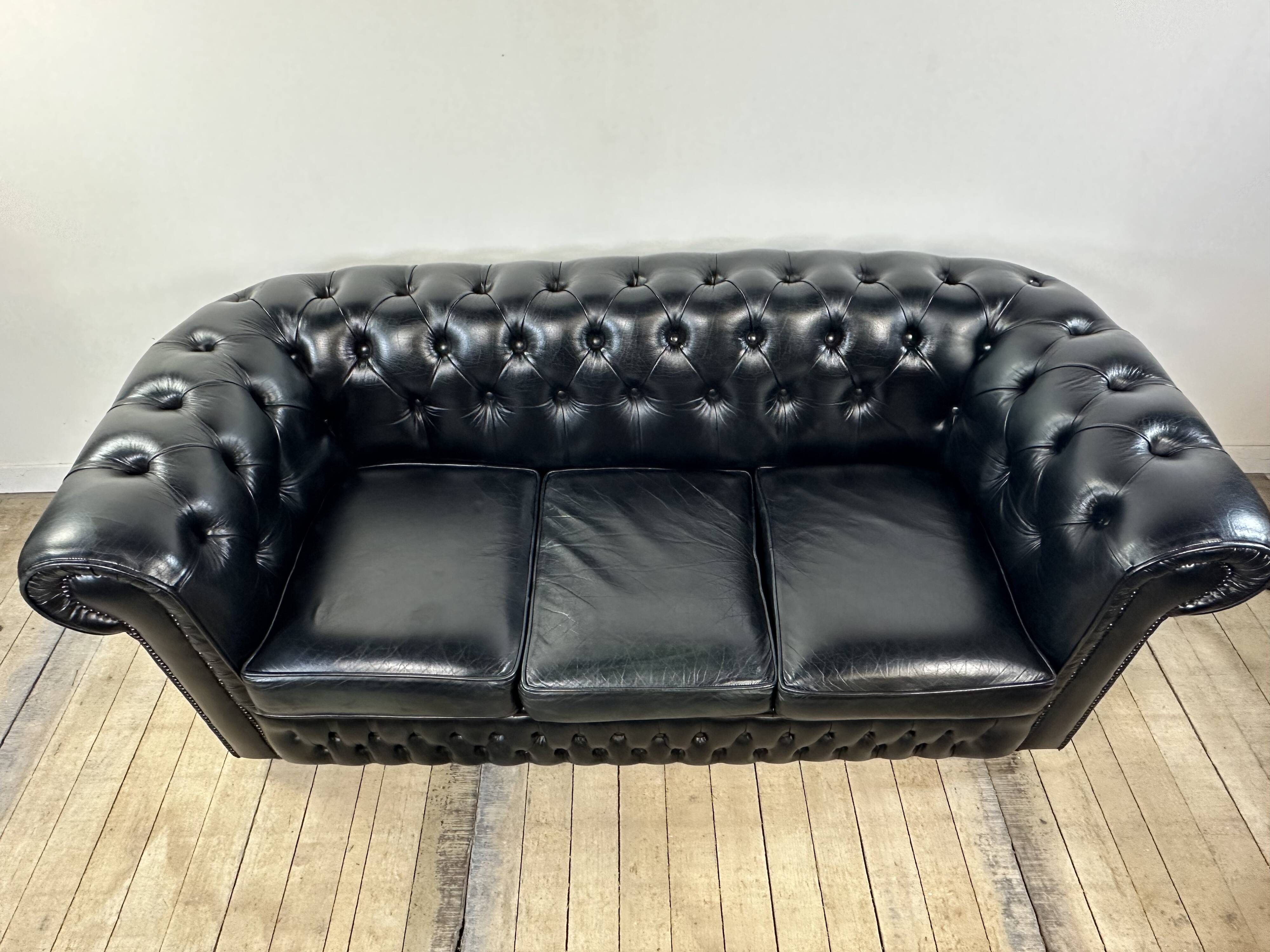 Vintage 1980 black leather Chesterfield sofa