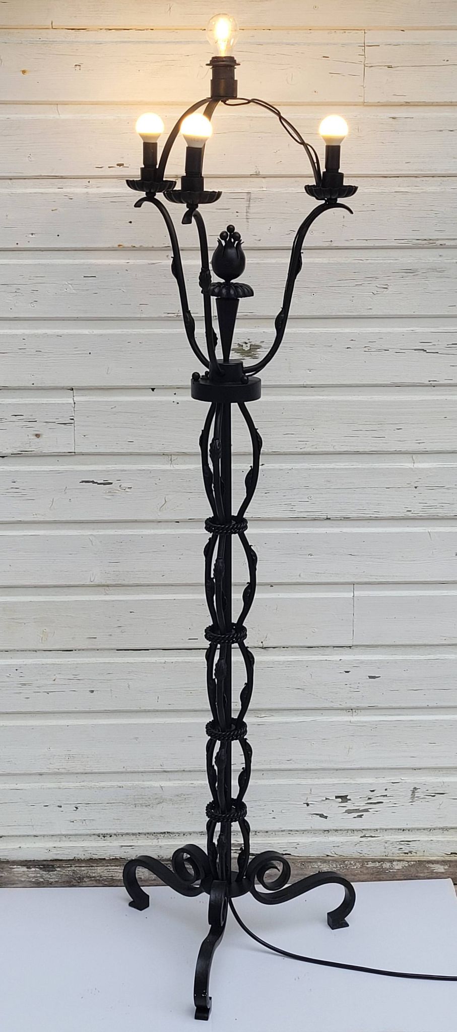 Black wrought iron floor lamp attributed to Gilbert Poillerat