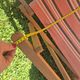 vintage wooden deck chair with striped fabric and footrest
