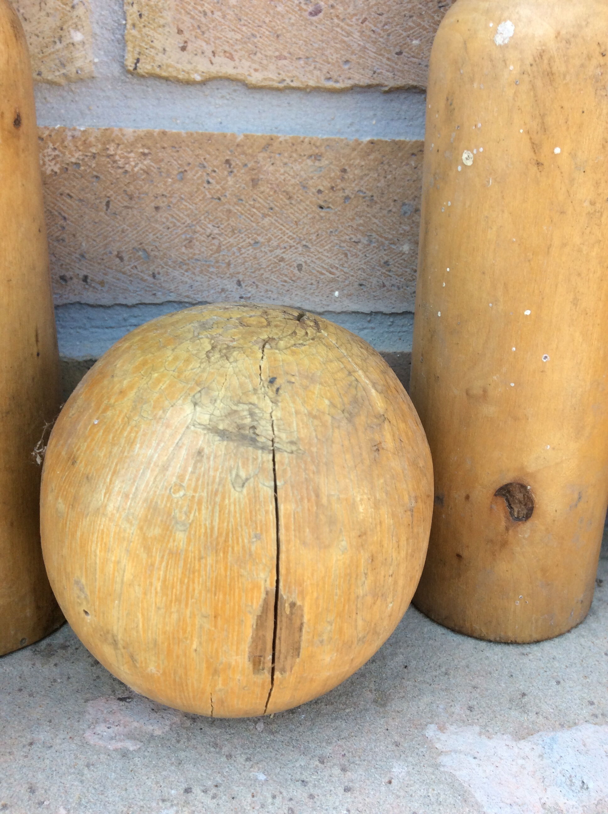 Wooden bowling and 2 vintage balls