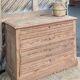 Large antique chest of drawers in raw solid wood.