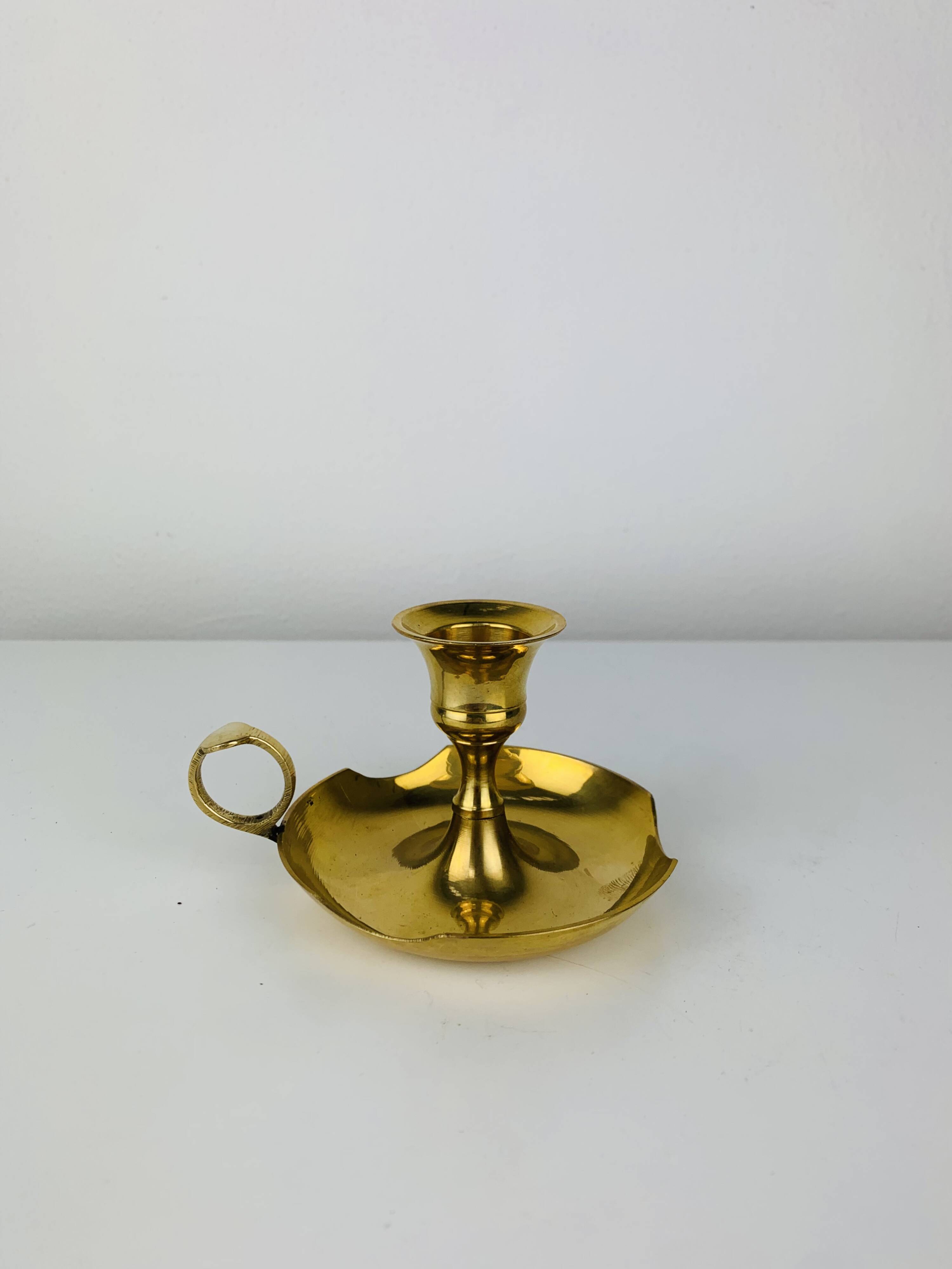 Golden brass candlestick rat of the cellar