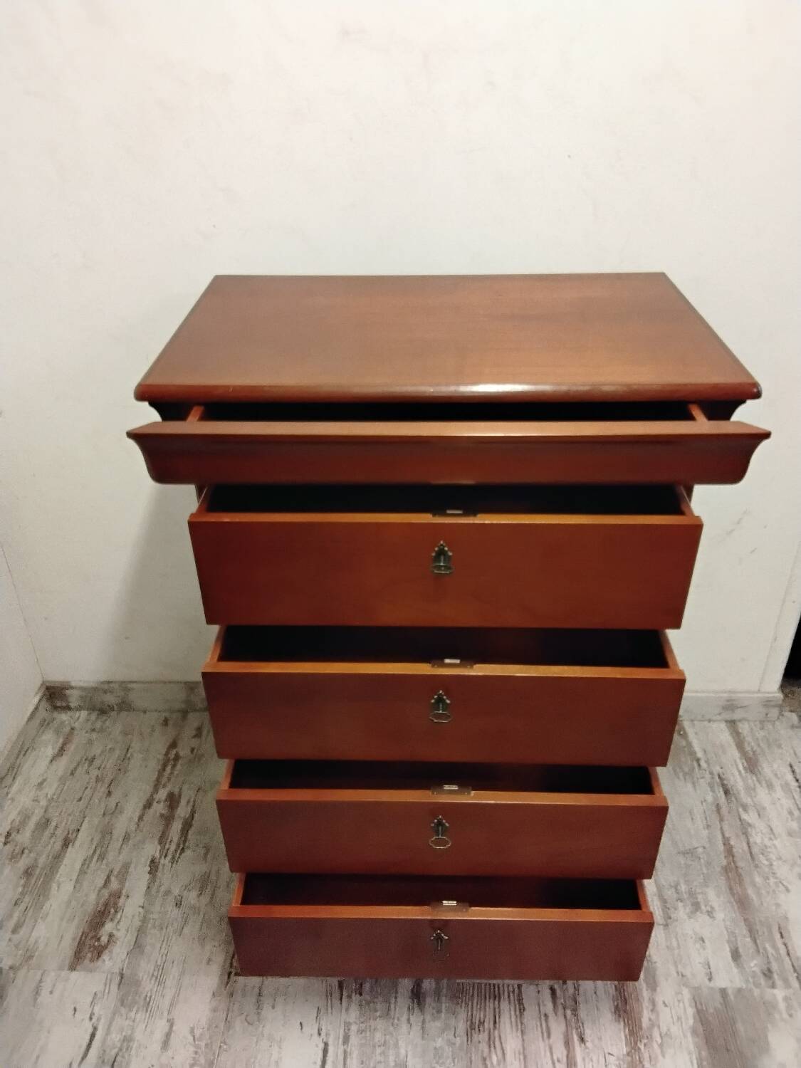Wooden chest of drawers with a secret drawer