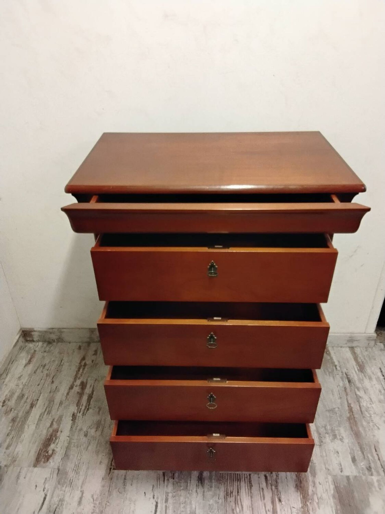 Wooden chest of drawers with a secret drawer