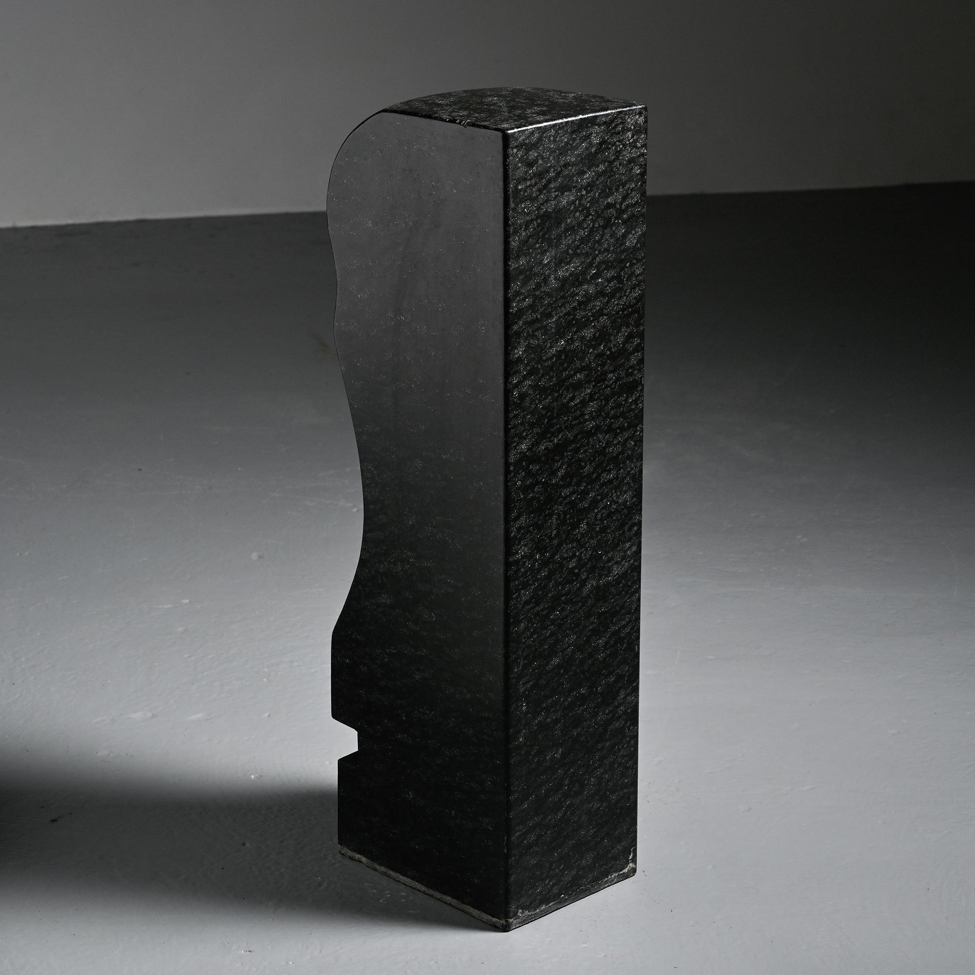 Abstract sculpture in diabase by Robert Neuhauser, Switzerland, circa 1985.
