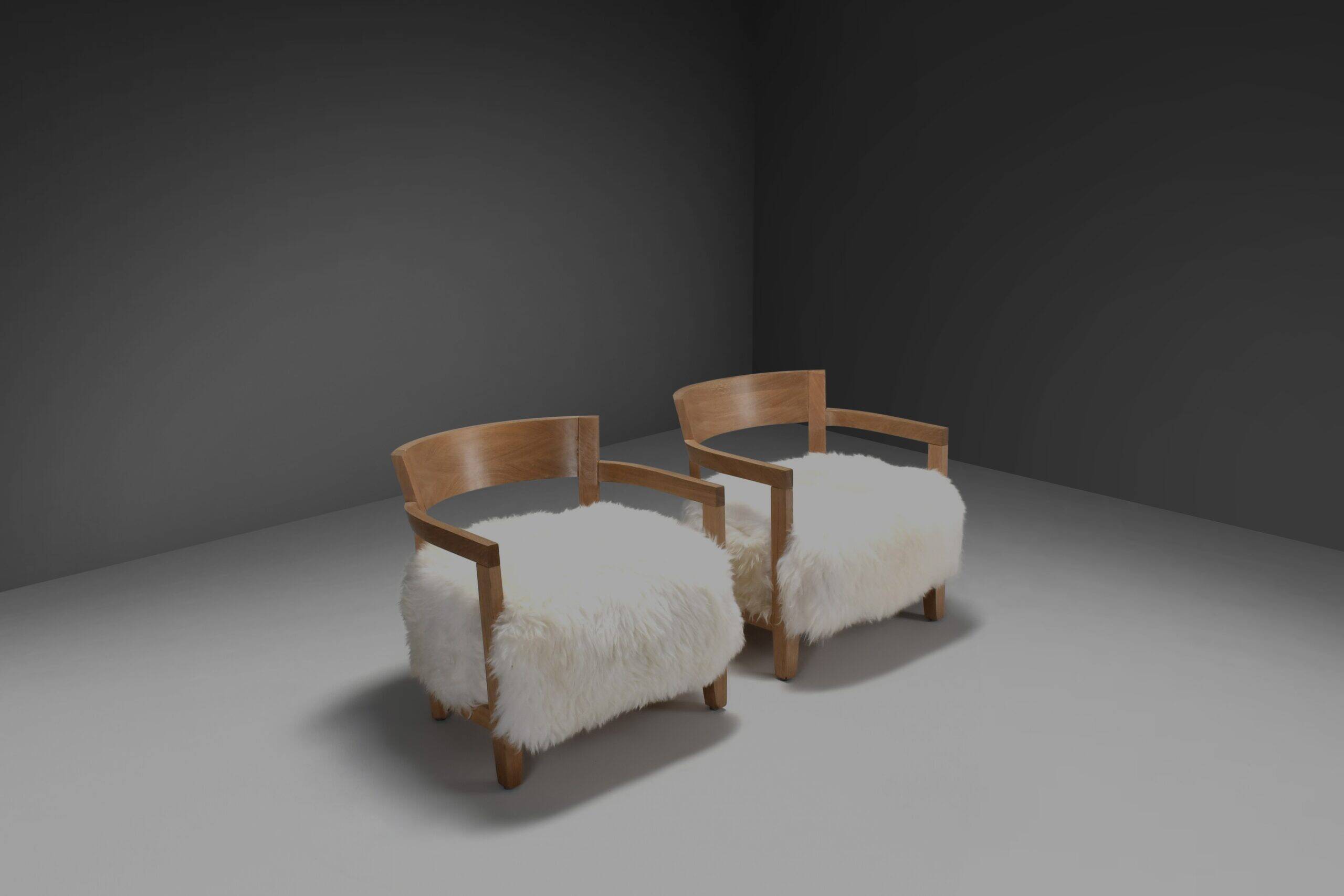 Set of two solid oak and off-white sheepskin chairs, Switzerland, 1970s