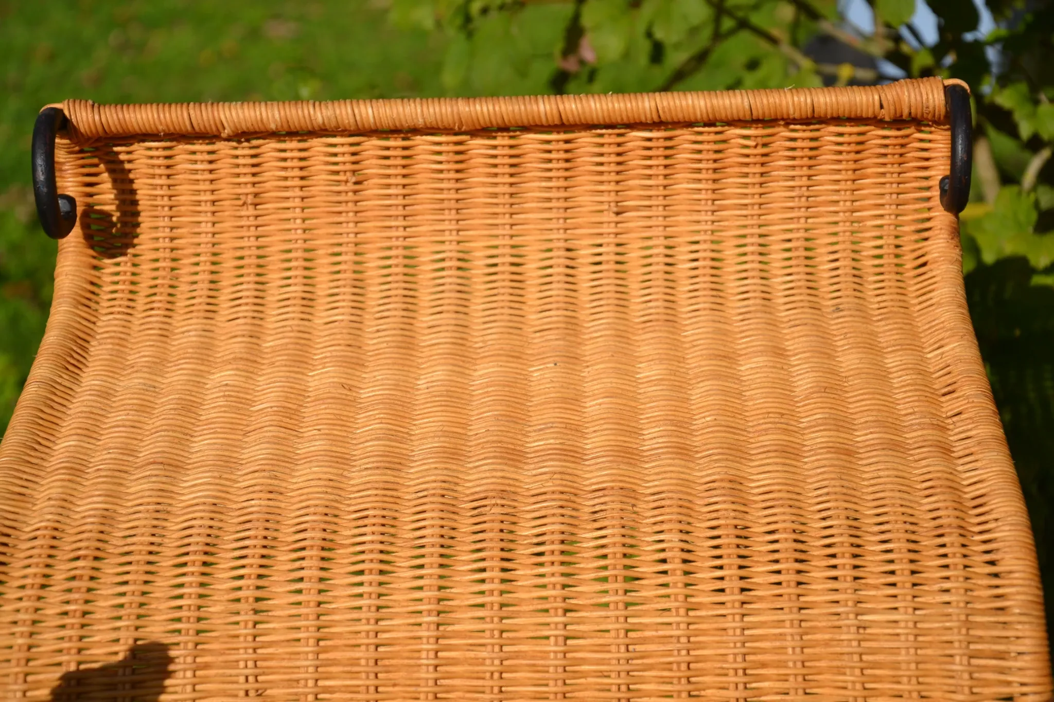 Wrought iron and rattan magazine/newspaper rack