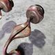 Paire de bougeoirs muraux en bronze figurant un serpent, 1960