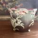 Antique cache-pot from the 1900s in majolica with a raised floral decoration in pink, very decorative.
