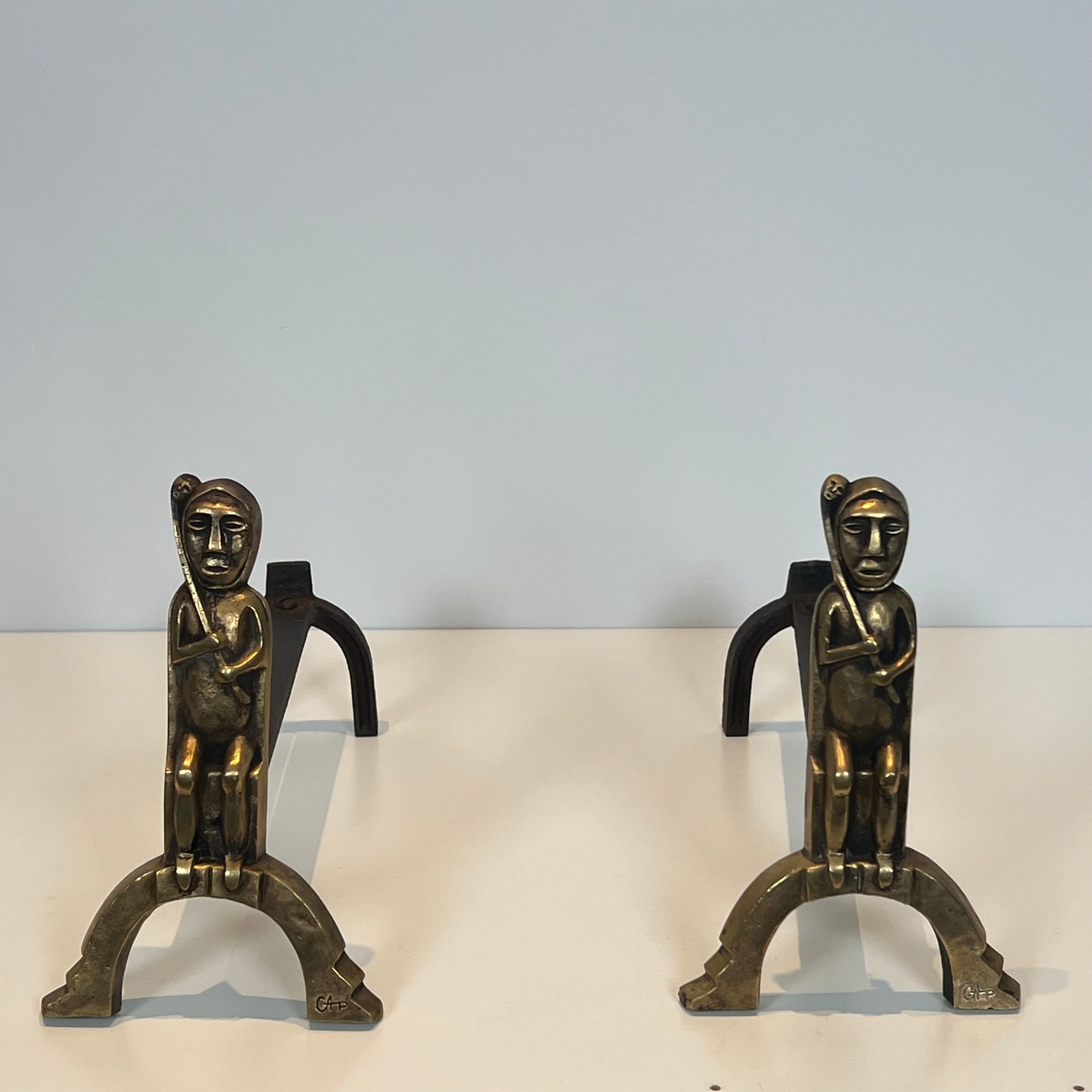 Pair of bronze andirons with seated shamans monogrammed Anton Prinner