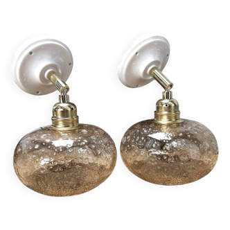 Pair of gold globe wall lights