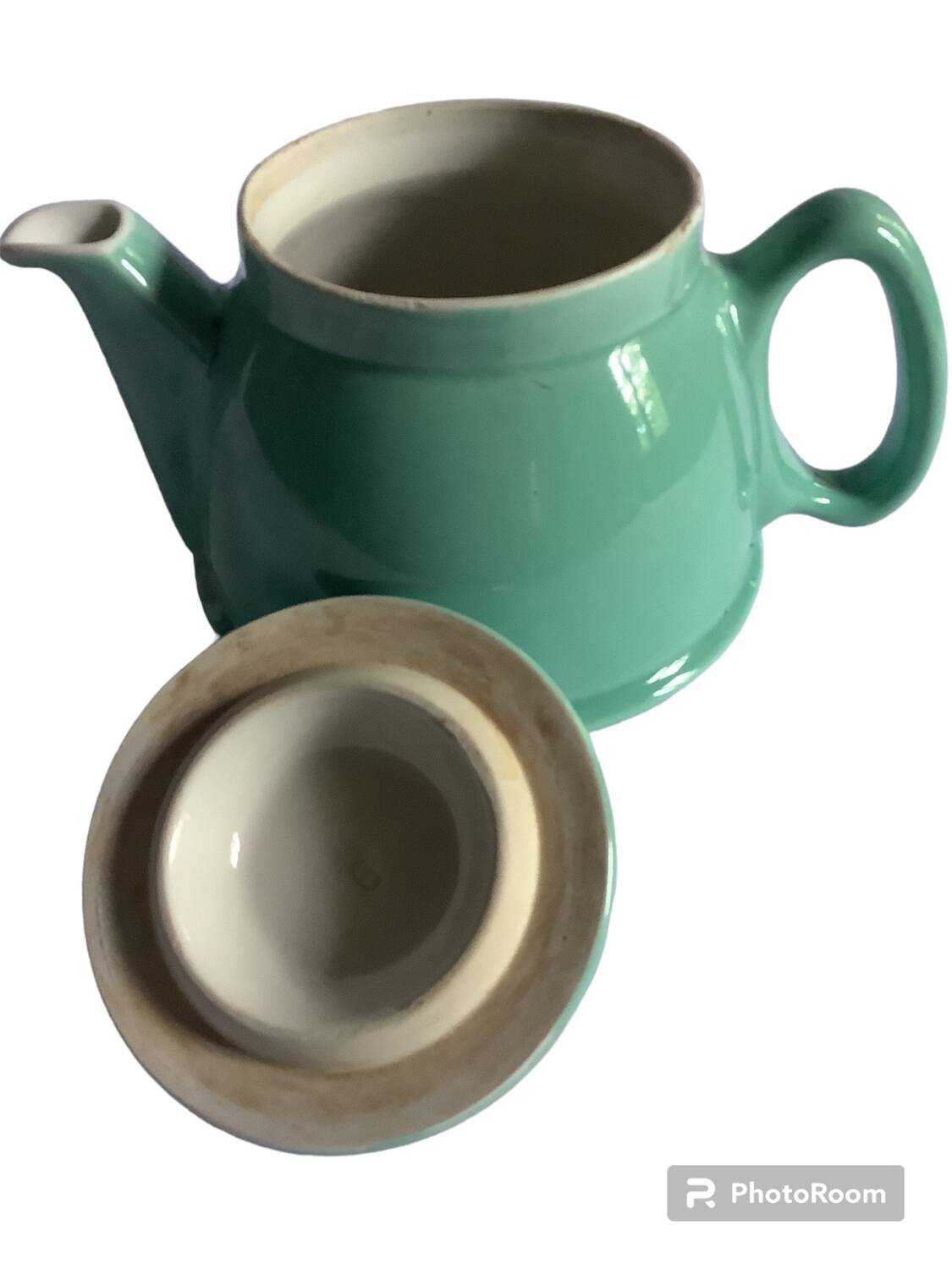 Old green ceramic teapot