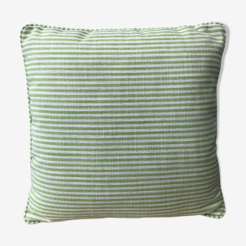 Green and white striped cushion