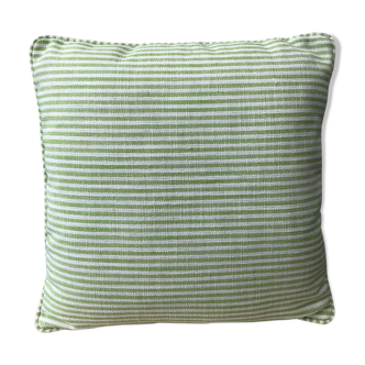 Green and white striped cushion