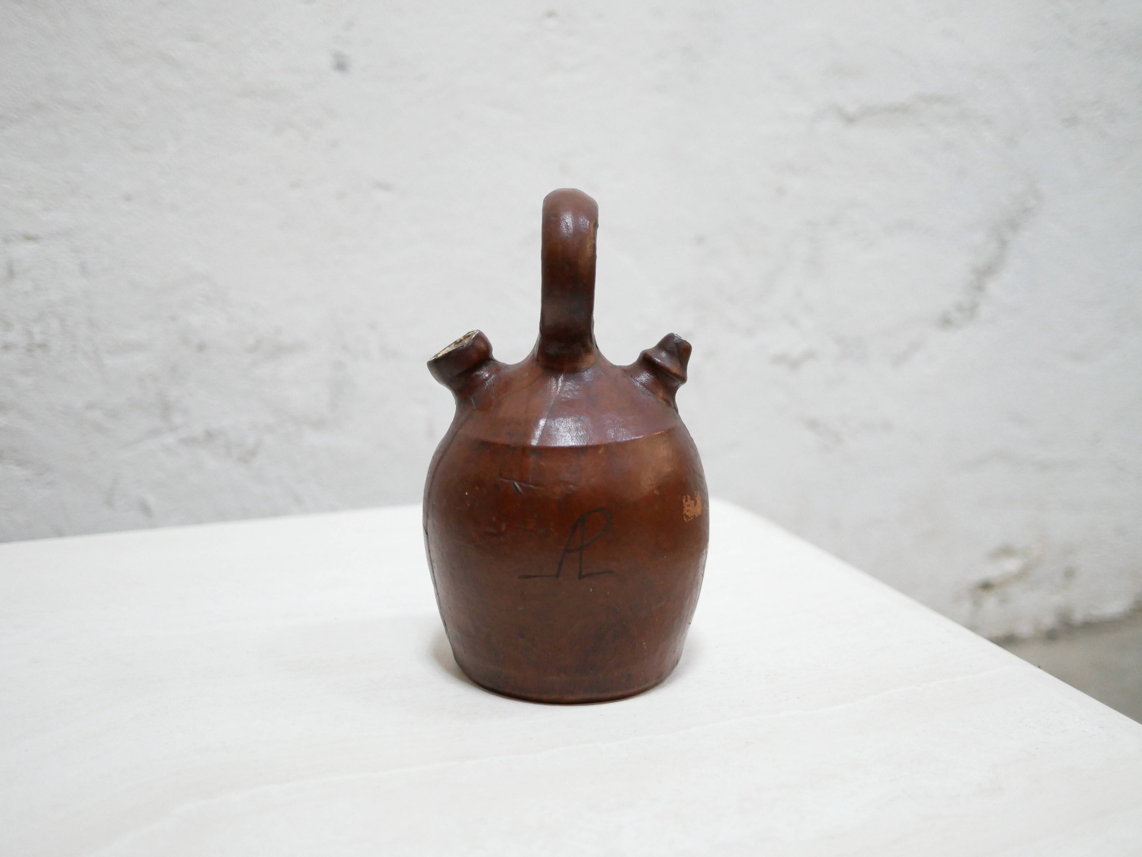 Vintage leather gargoulette pot