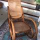 Rocking-chair with cane seating and backrest.
