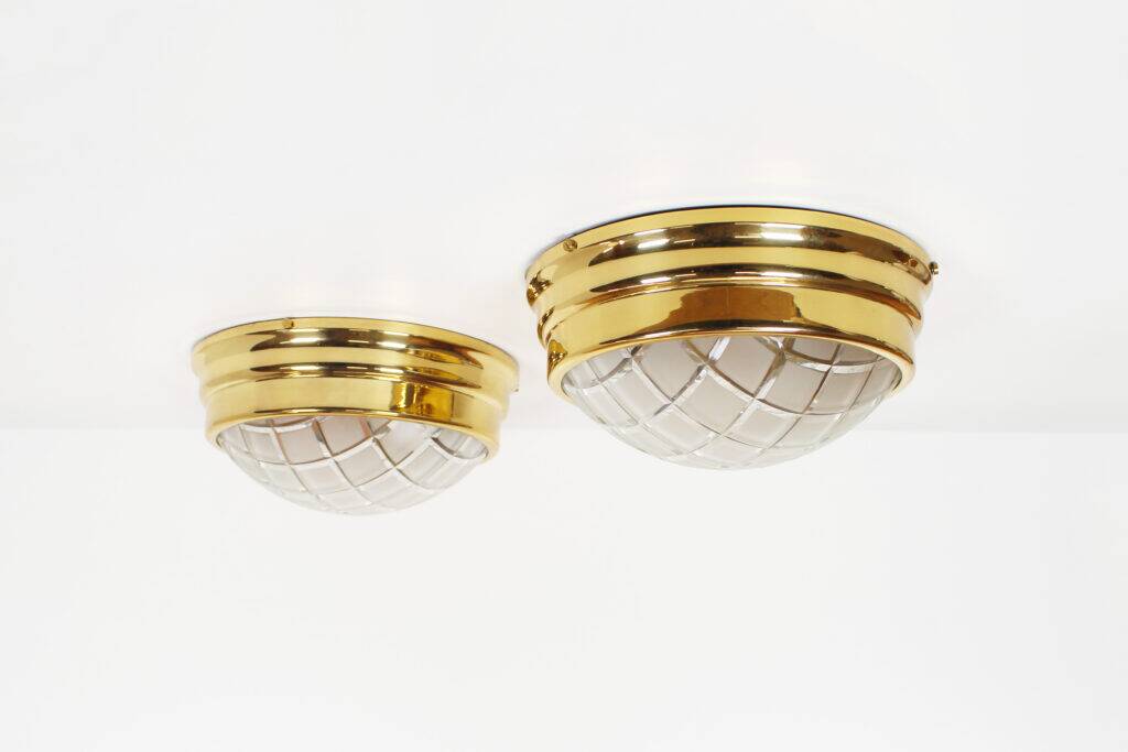 Pair of vintage brass ceiling lights with glass globe