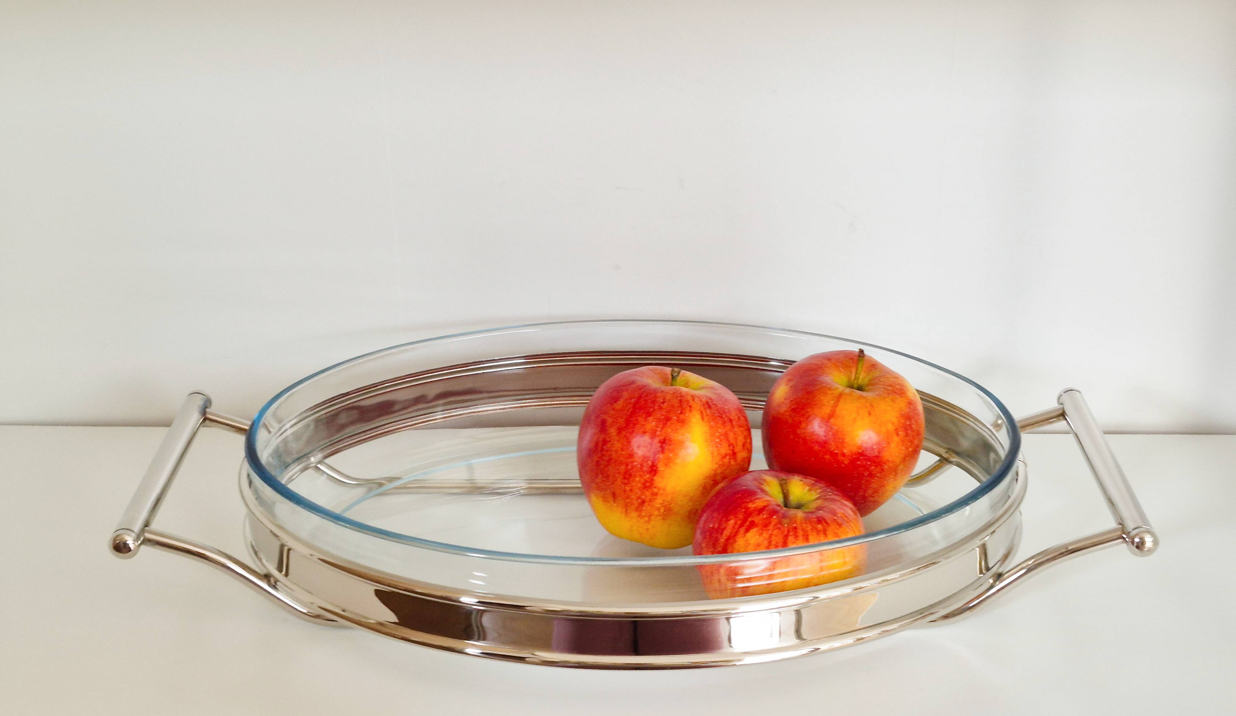 Oval Pyrex gratin dish, silver-plated metal stand.