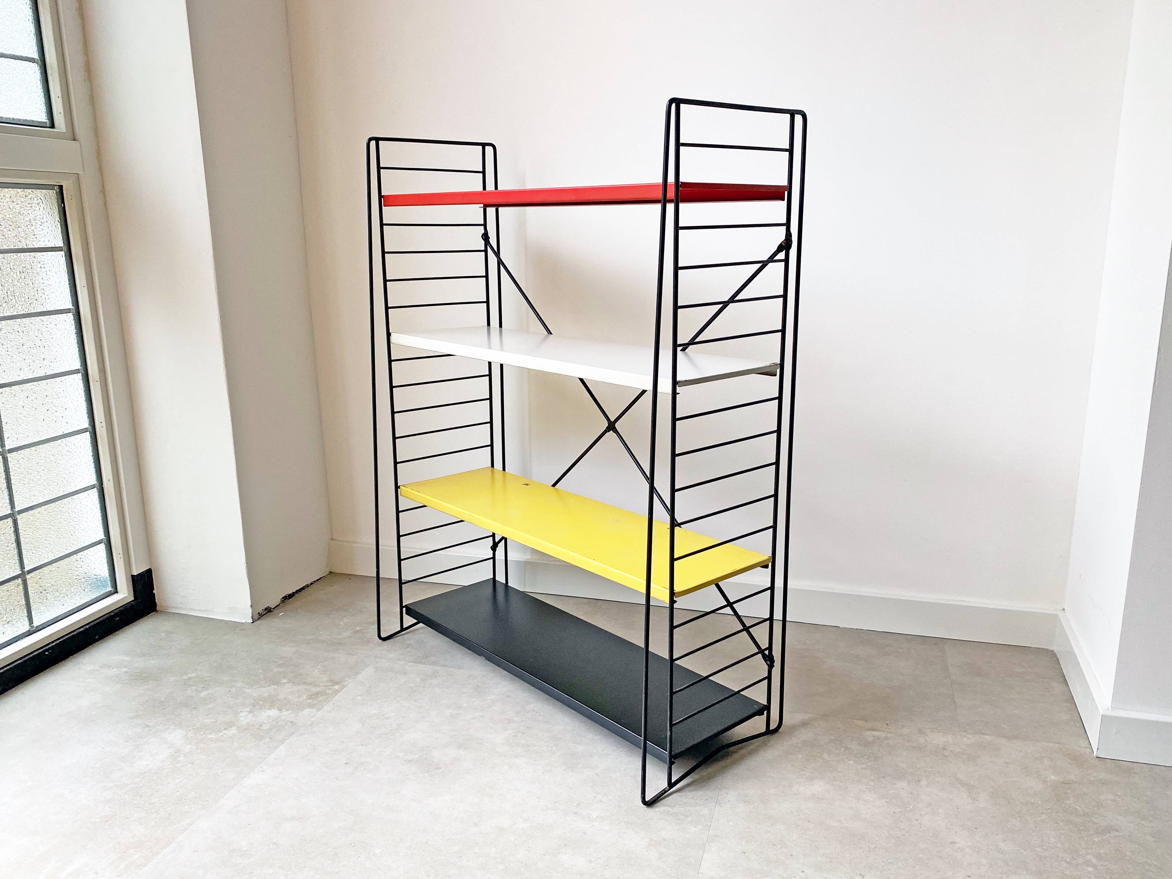 Mid century free standing tomado shelving system / bookcase designed by d. dekker