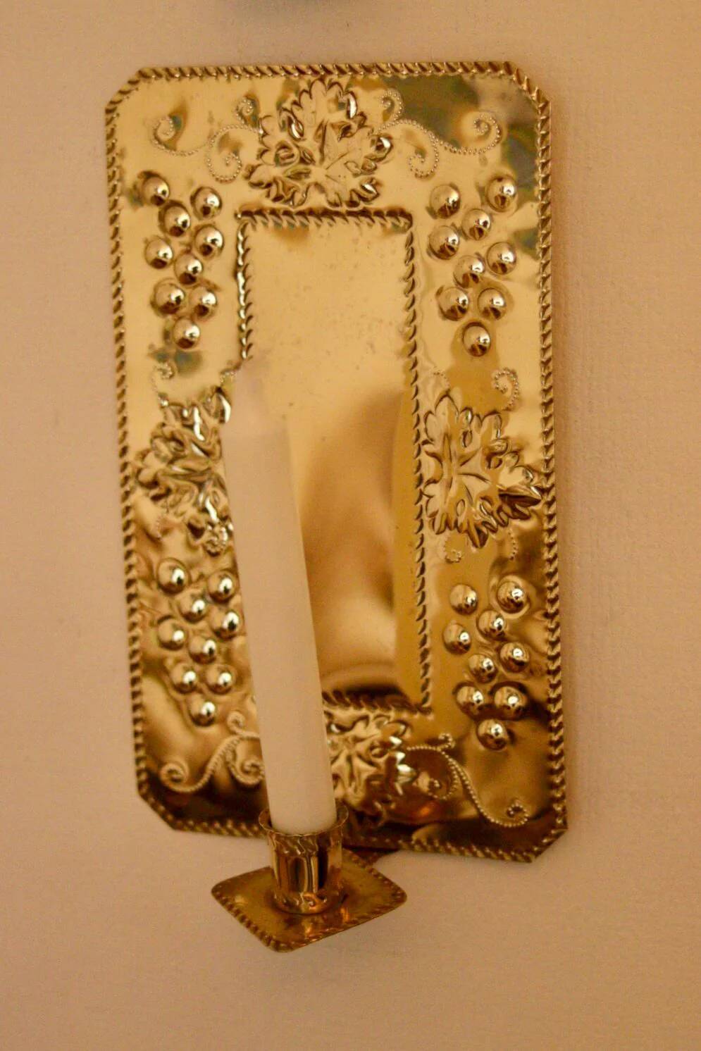 A pair of Swedish brass wall sconces from the mid-century.