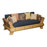 Vintage 1970s canapé with bamboo frame and Aztec patterns.