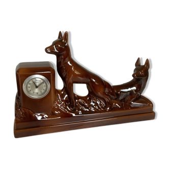 Old scout clock with two brown earthenware dogs