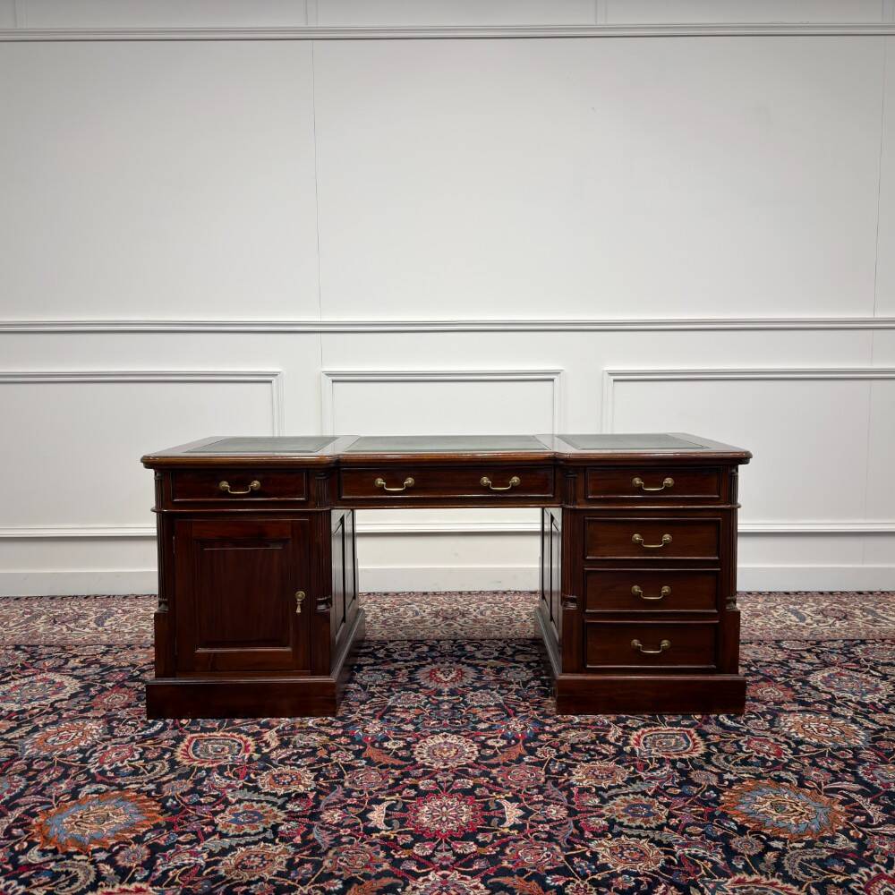 Classic English desk with green leather inlay.