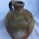 Ancient jug in glazed sandstone
