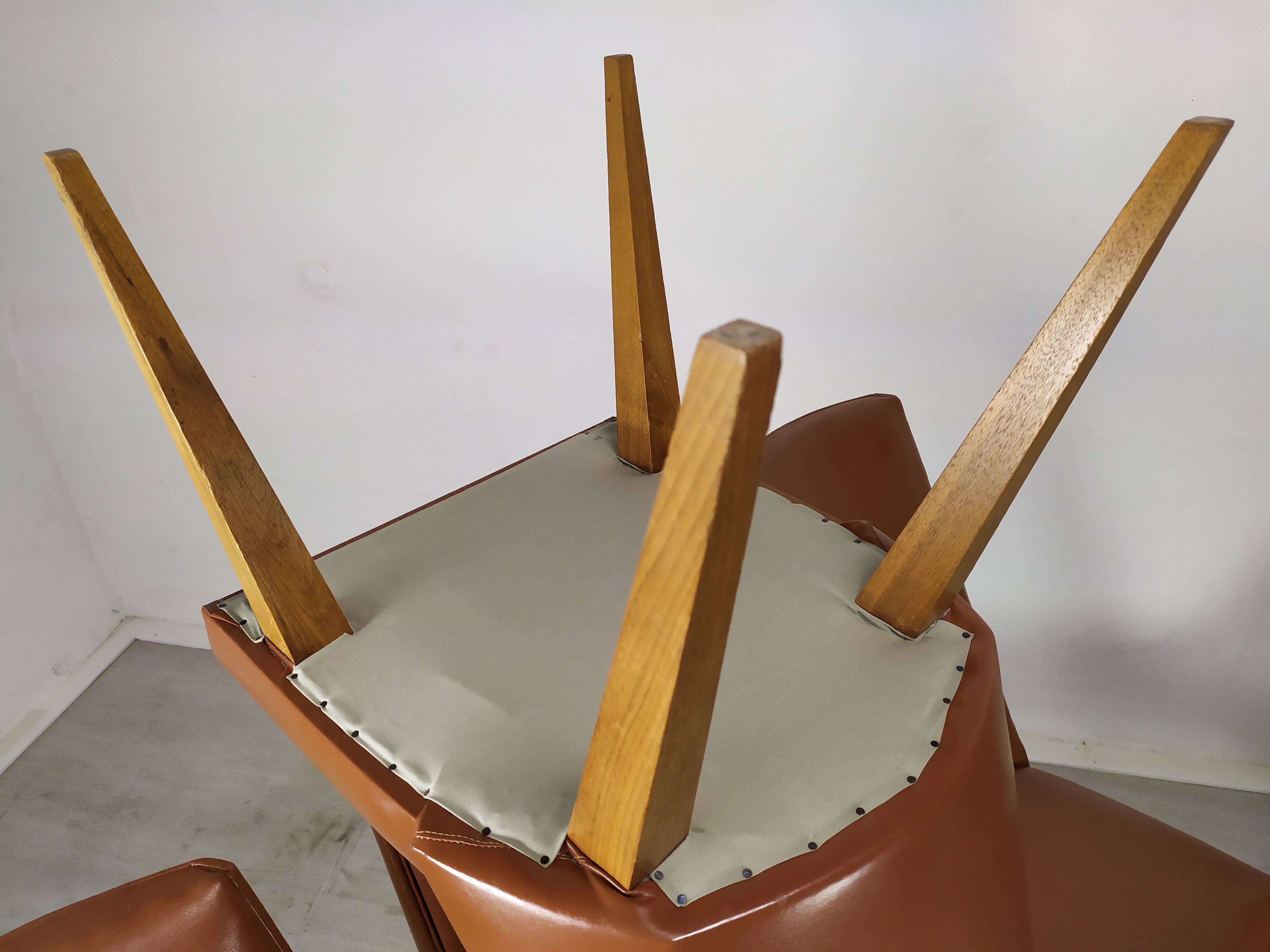8 brown skai chairs 1950