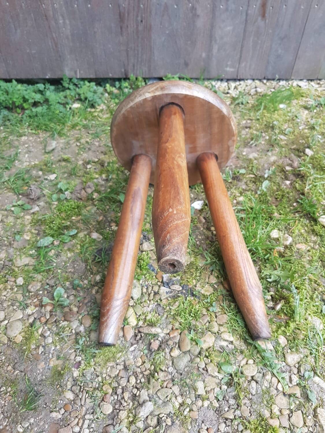 Old vintage wooden tripod milking stool