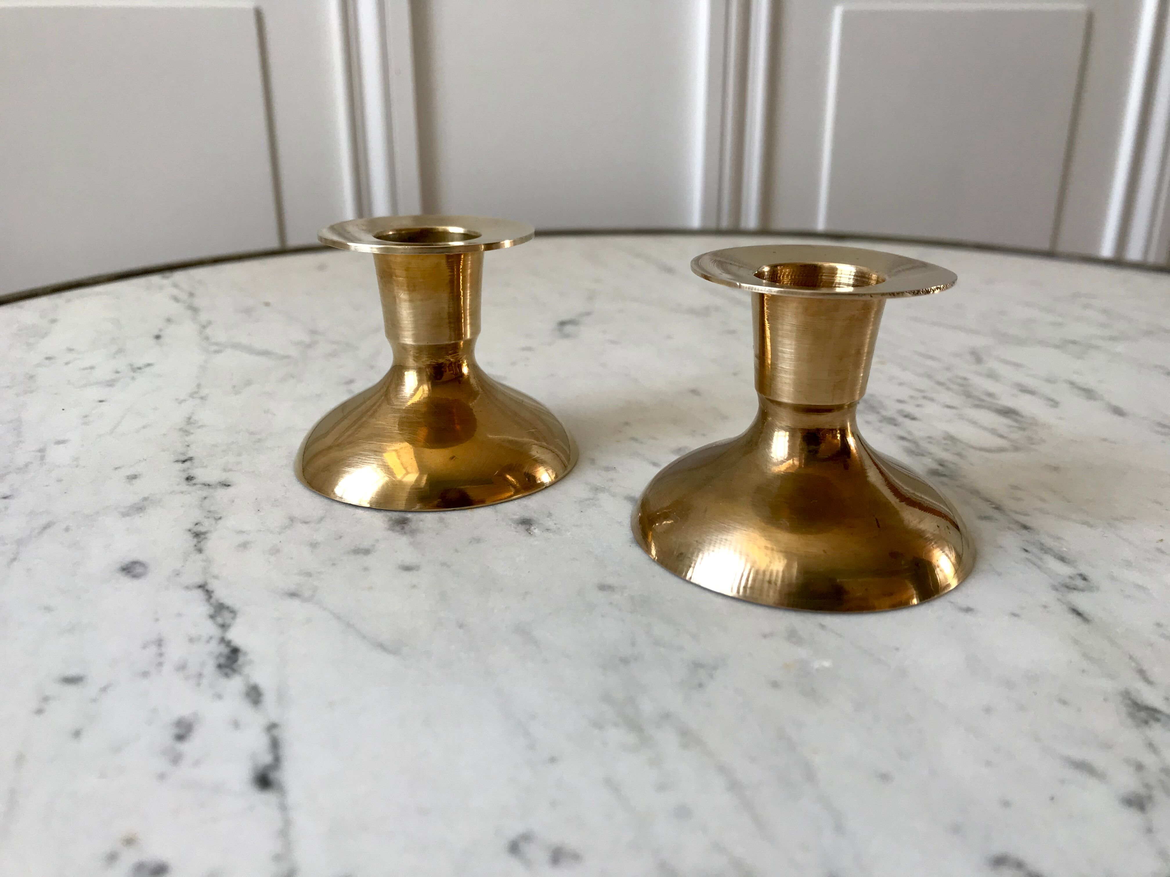 Duo of brass candle holders 20s
