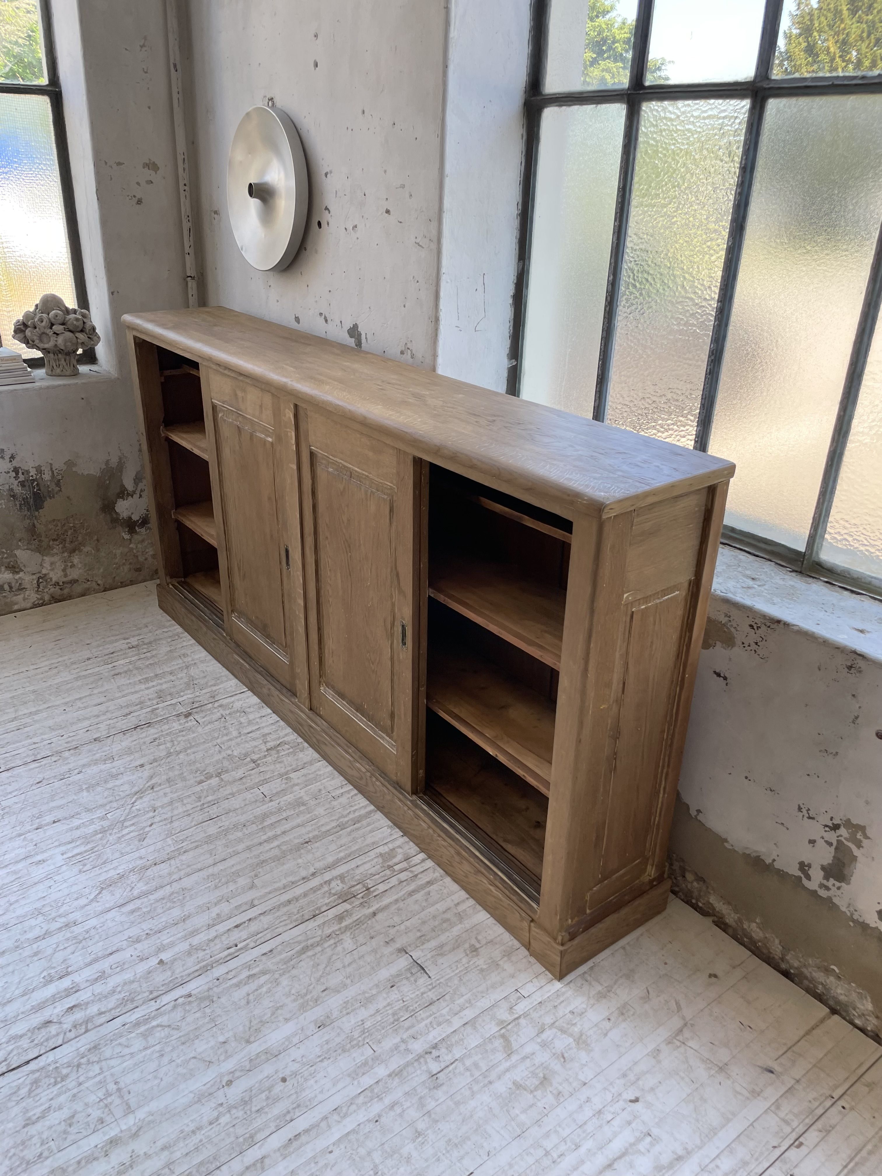 Large row of solid oak loom sliding doors