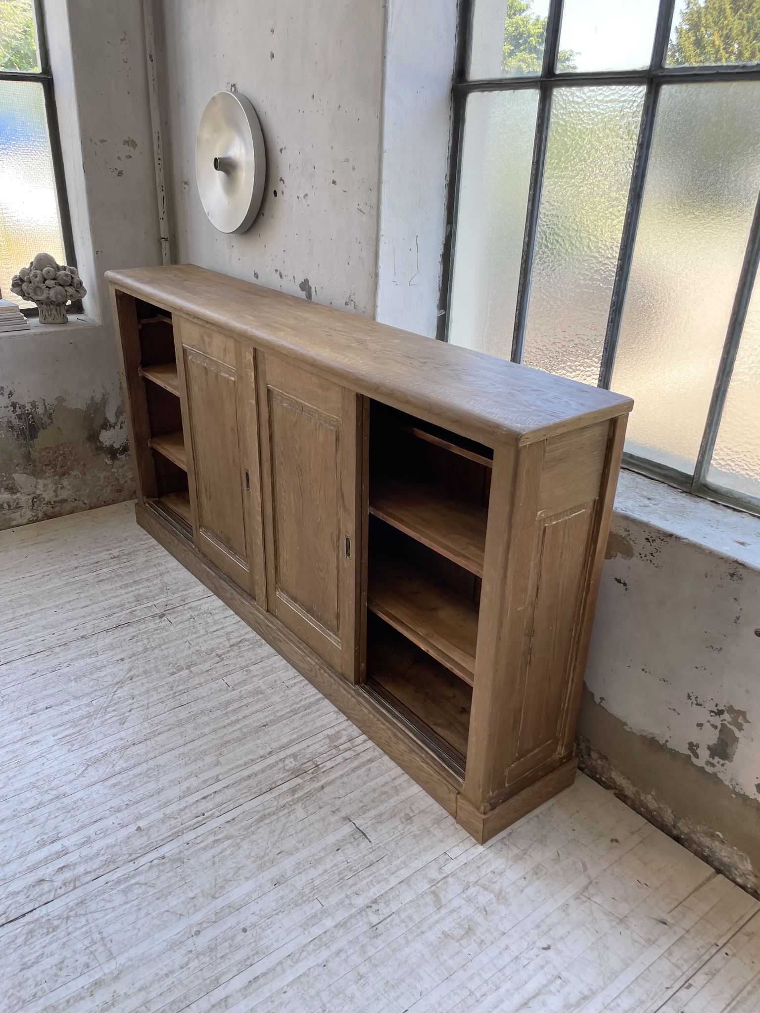 Large row of solid oak loom sliding doors