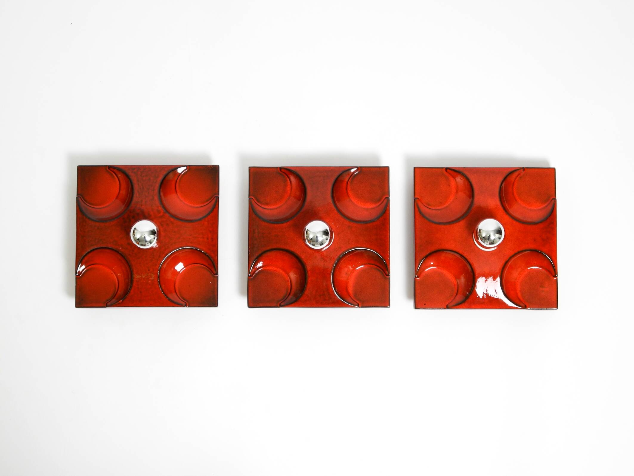 Three beautiful original 1970s Space Age red ceramic wall lamps