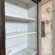 Display cabinet in patinated wood