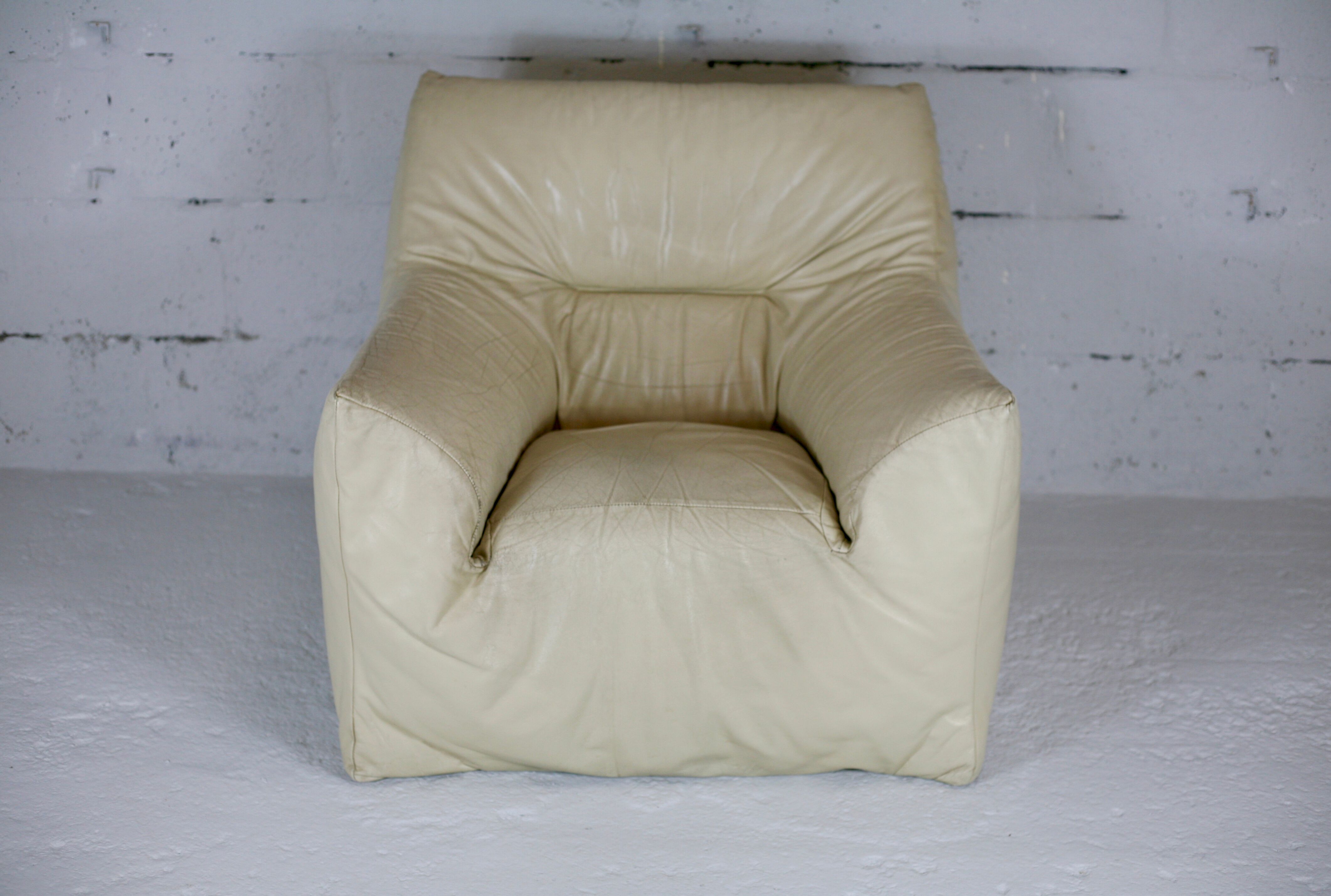 Leather armchair and cream-coloured foam, France , circa 1970