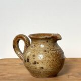 Small beige speckled stoneware pitcher