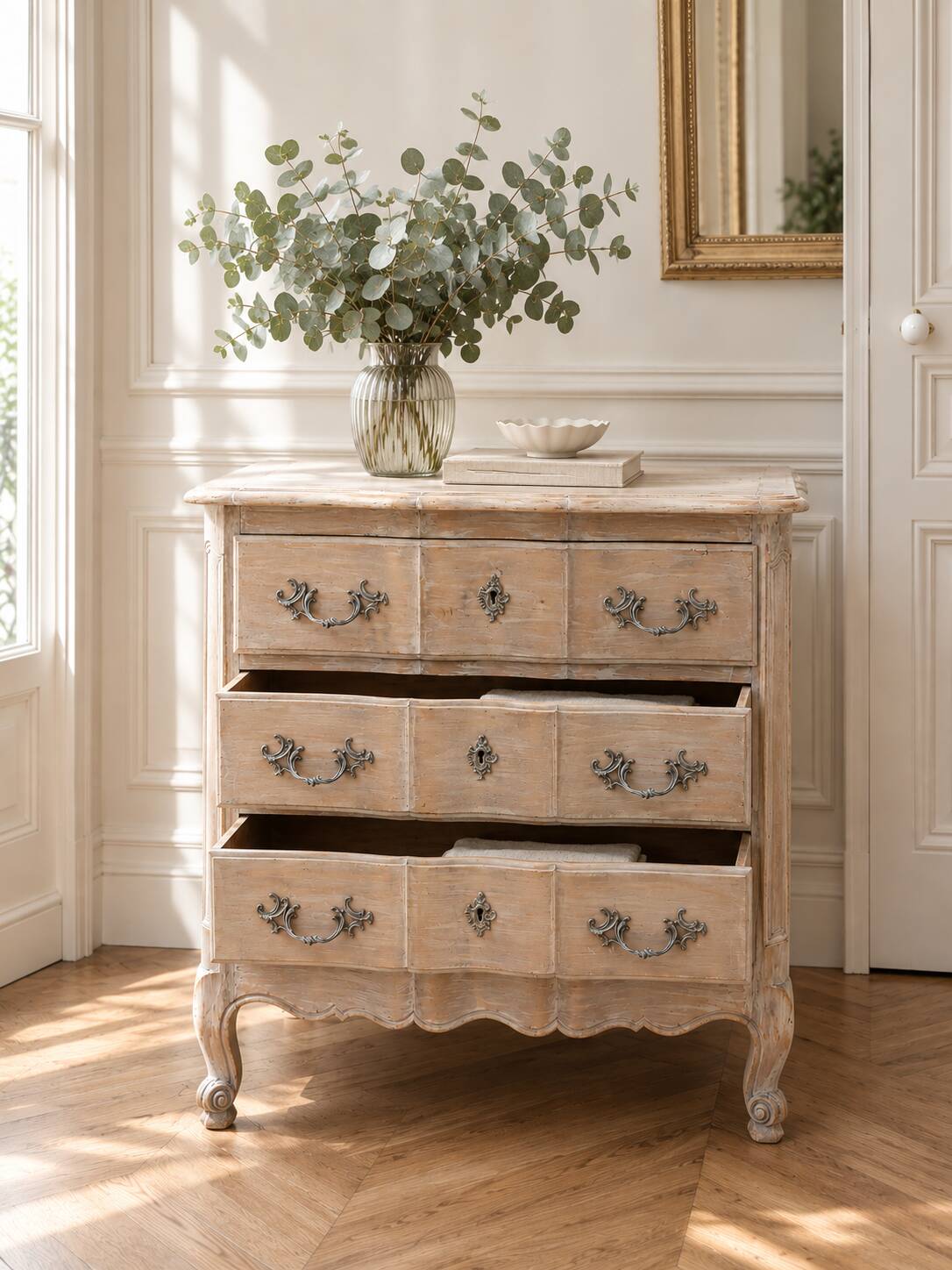 Beautifully crafted Louis XVI style commode in bleached wood.