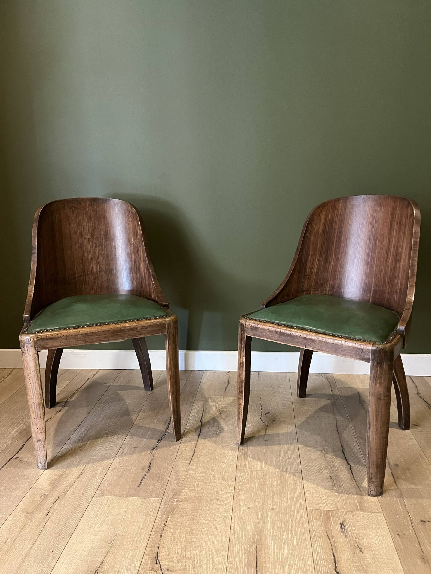 Pair of green leather gondola chairs Art Deco by De Coen