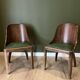 Pair of green leather gondola chairs Art Deco by De Coen